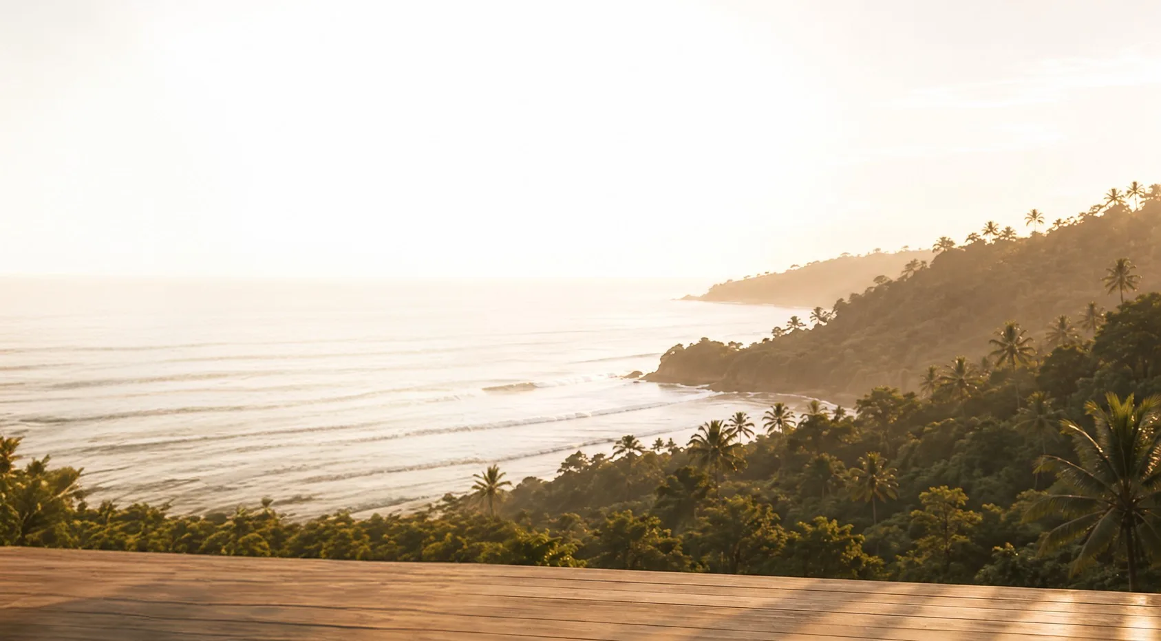Students practising yoga on an open-air deck overlooking the sea in Goa